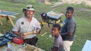 Bonnie Floyd shares a moment of love and trust with a child in Barbuda.